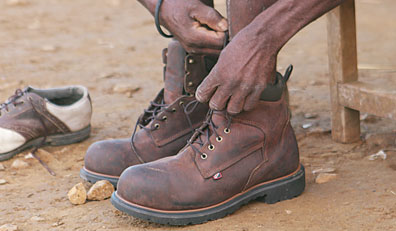 Putting-on-boots | Boots on the Ground | IBWPPI